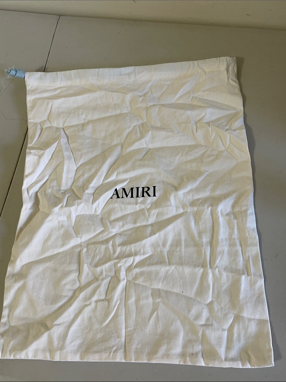 AMIRI White Drawstring Dust Bag with Black Logo